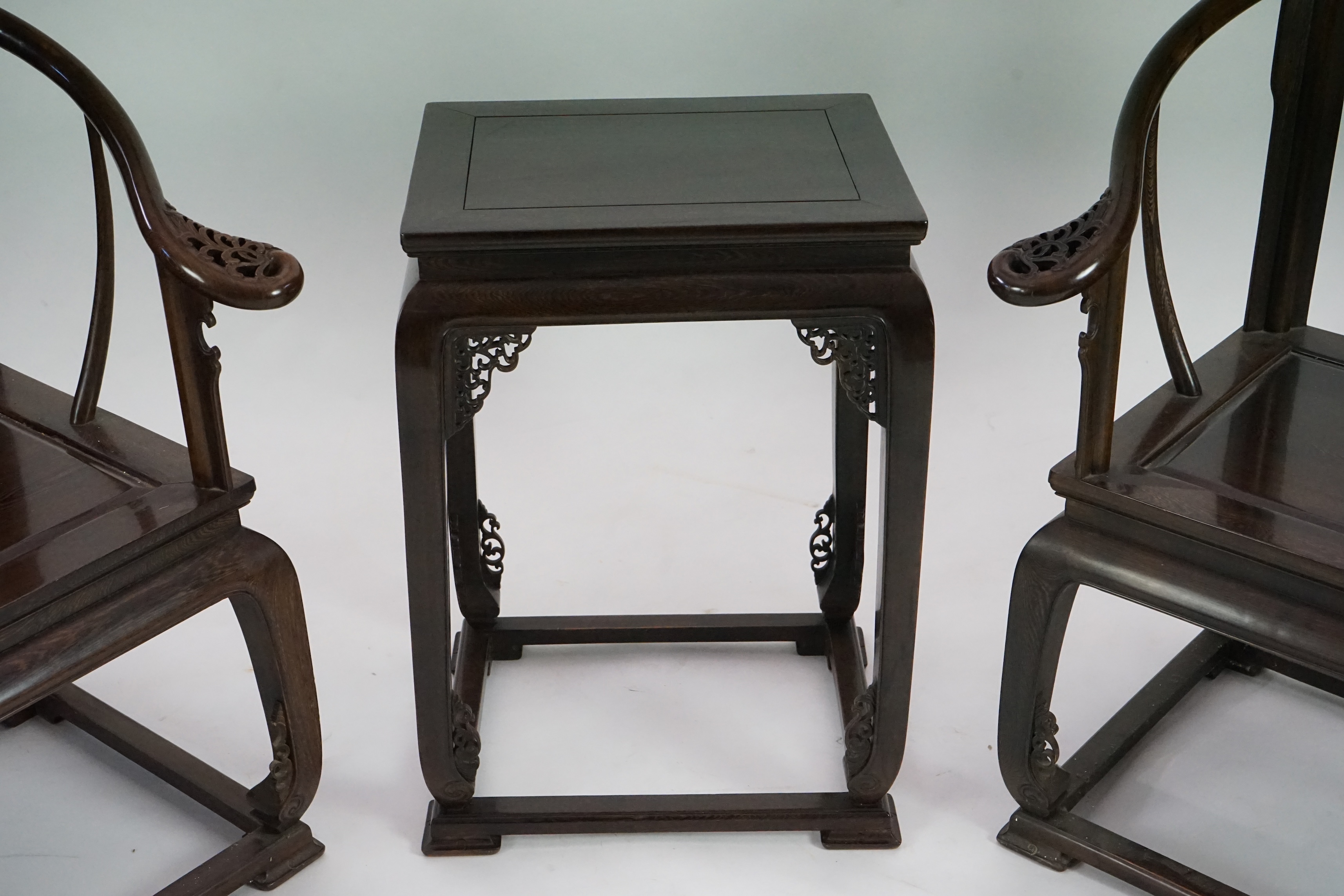 A pair of Chinese jichimu horseshoe shaped armchairs and a matching table, 19th/20th century